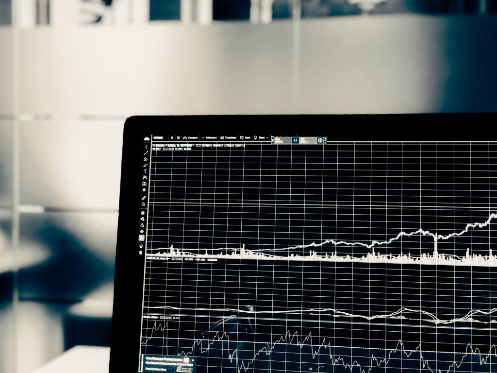 Forex trader analyzing interest rate news and economic calendar in How Interest Rates Affect Currency Prices