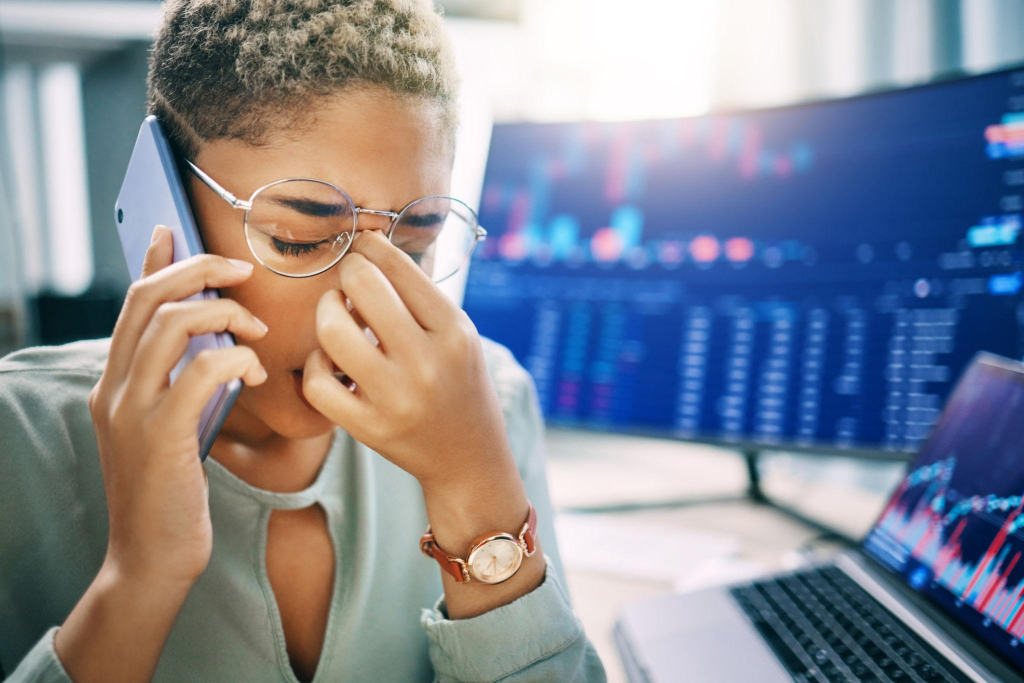 Frustrated woman, phone call and headache in trading, fail or mistake from stock market crash at office.